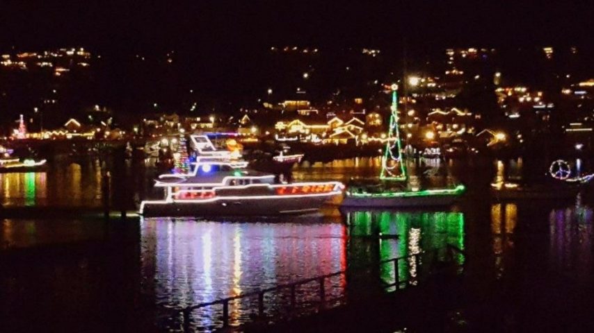 Lighted boats in Gig Harbor Washington, power and sail