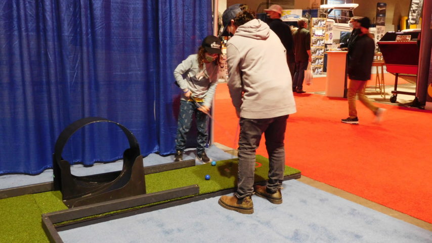 Children playing the 9-hole putt course at the Boat Show