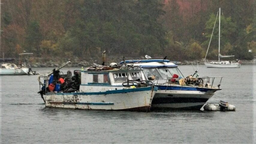 Two derelict vessels anchored in False Creek, Vancouver BC