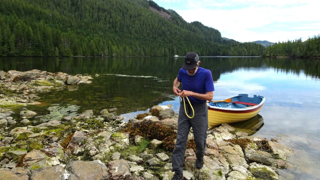 Michael with skiff in Explorer's Inlet anchorage
