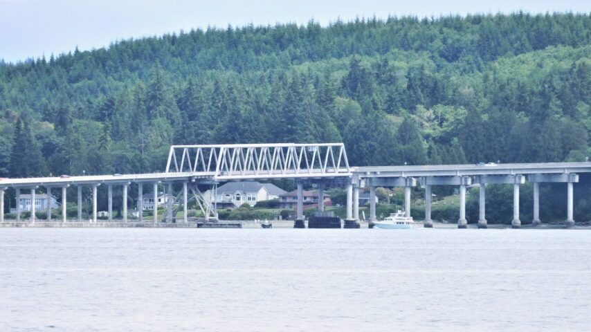 Boat going under west end truss of Hood Canal Bridge