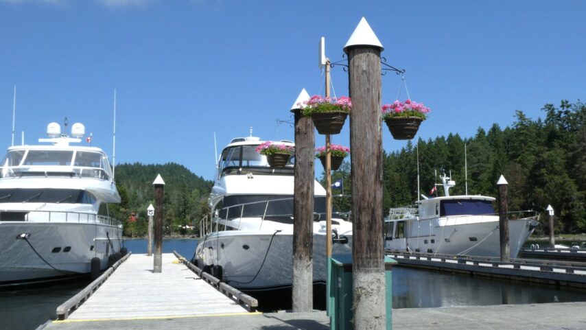 Photo of boats at the dock and flower pots at Telegraph Harbour Marina