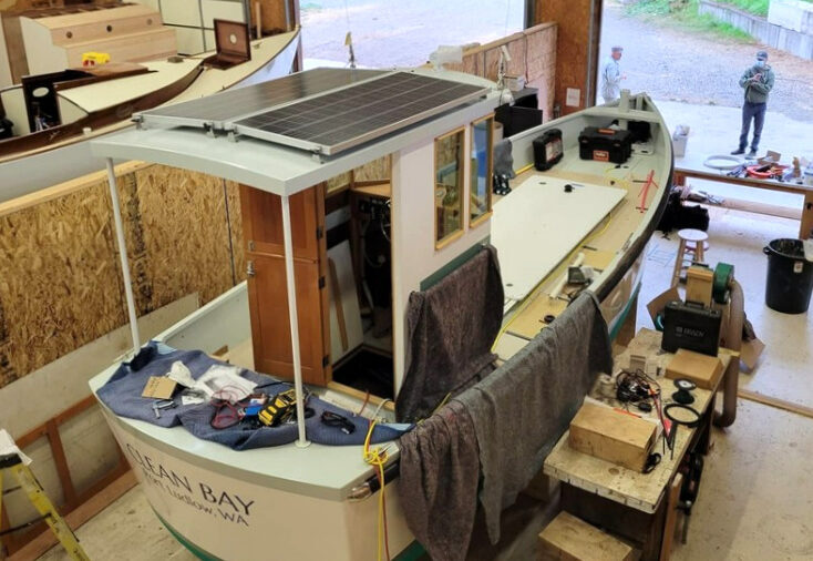 Photo of m/v Clean Boat in shop with solar panels installed