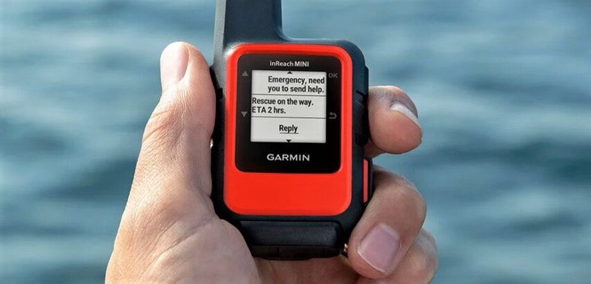 Someone holding a Garmin inReach device