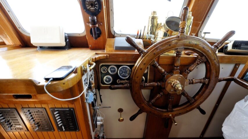 Photo of the classic helm inside m/v Puffin
