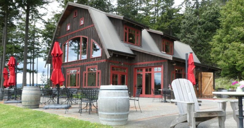 Photo of patio and lodge-style winery building