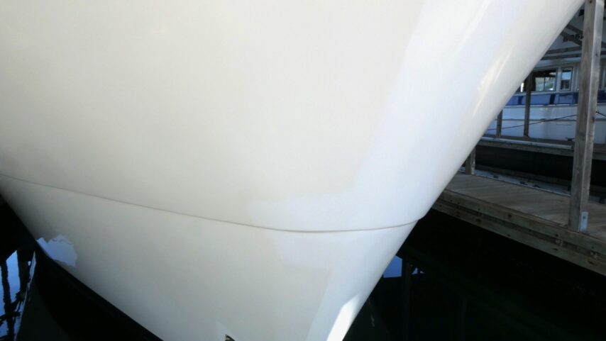Two-tone appearance on bow of boat before painting