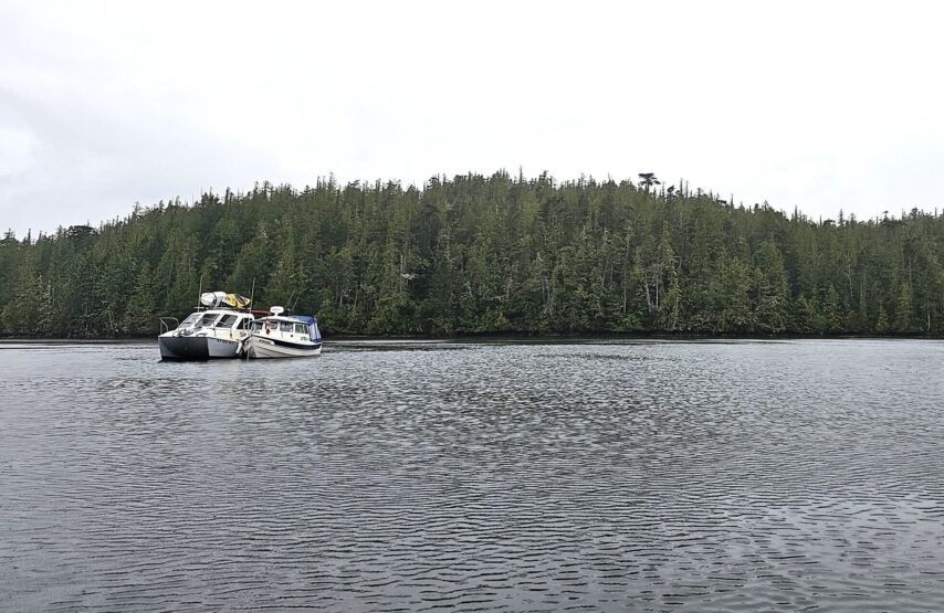 Two smaller boats in the flotilla rafted together in Allison Sound