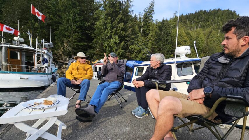 Flotilla group having cake at the dock of Bishop Bay