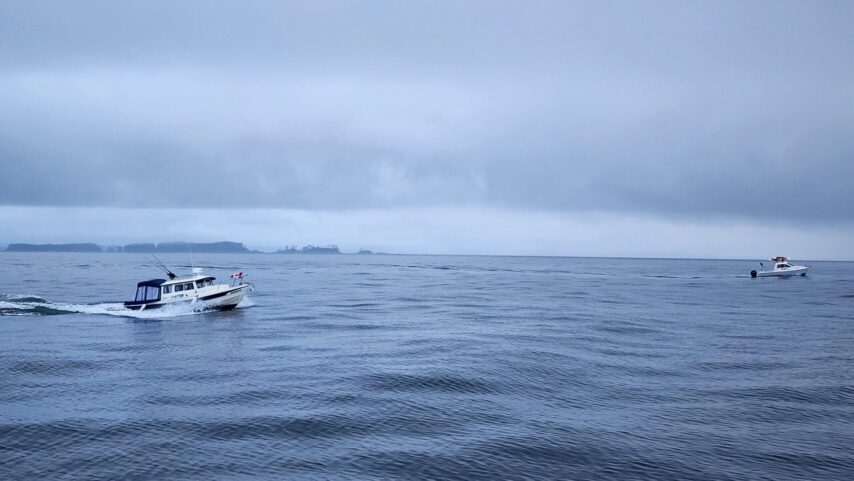 Smaller boats in the flotilla rounding Cape Caution