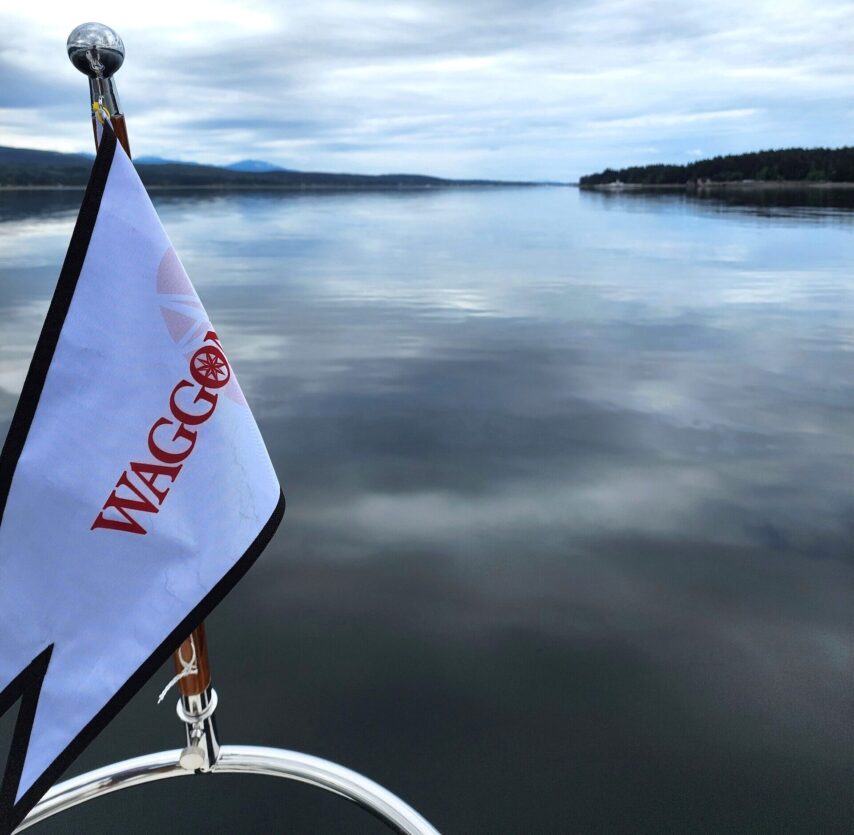 Flotilla underway with Waggoner Burgee Flag flying from the bow - very calm seas