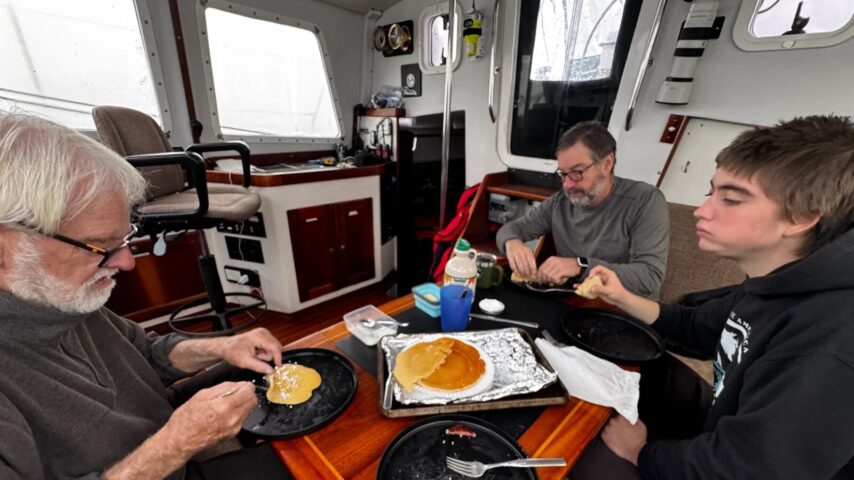 Crew of One Ocean eating pancakes for breakfast