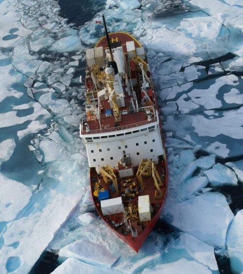 Photo of CCGS Amundsen breaking through ice