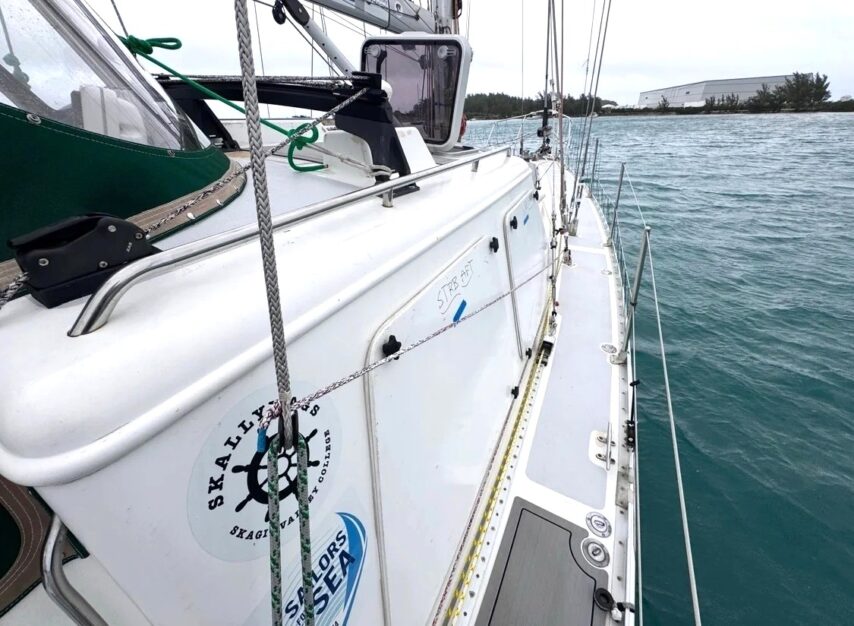 S/V One Ocean with storm boards over the side windows