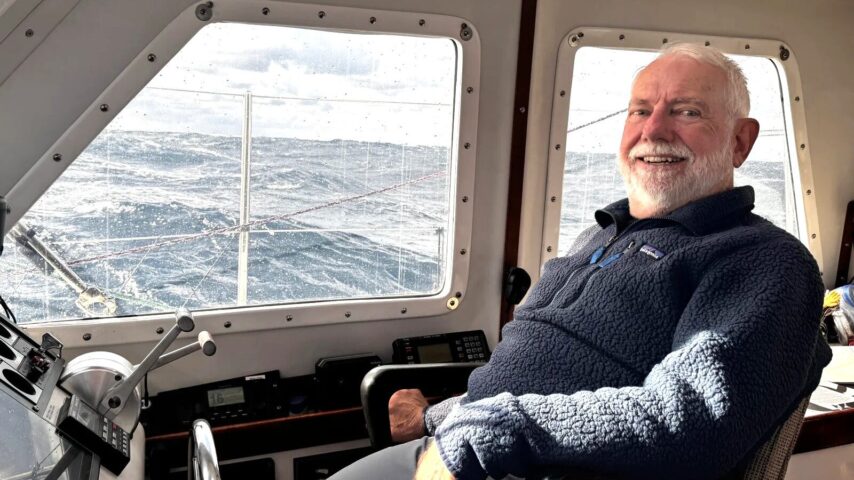 Photo of Charley at the helm inside the vessel One Ocean