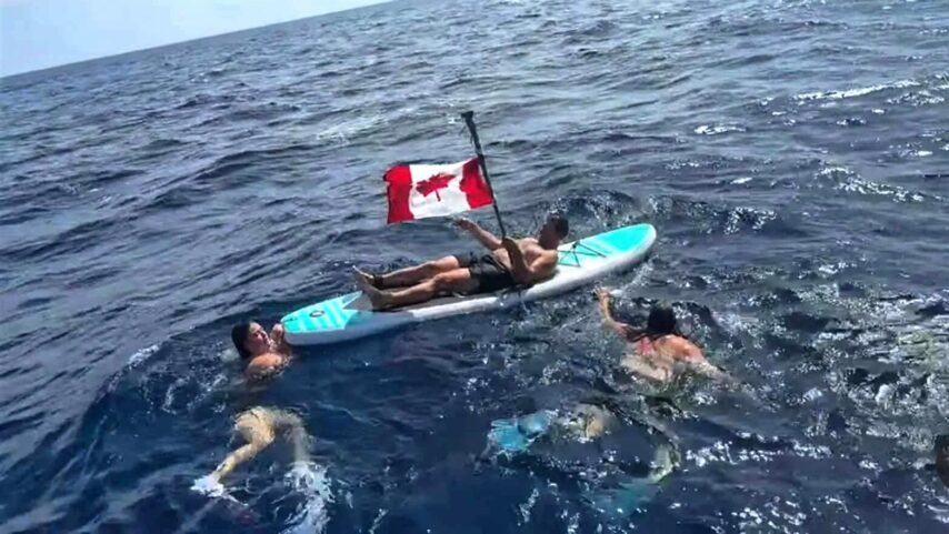 Crew of s/v One Ocean swimming at the Equator, a traditional ceremony when crossing