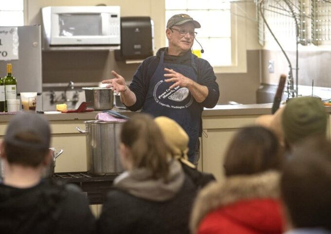 Photo of chef demonstrating how to cook mussels