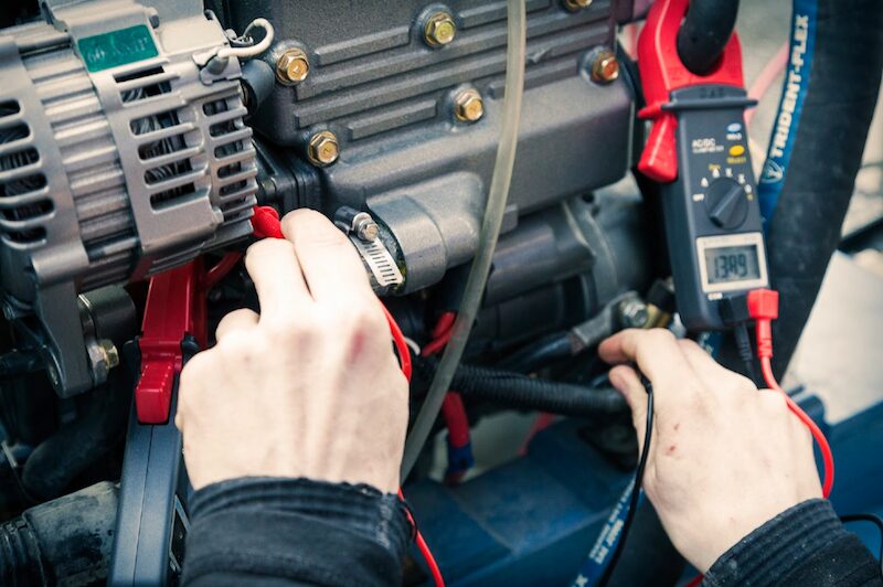 Photo of lady using a voltage meter