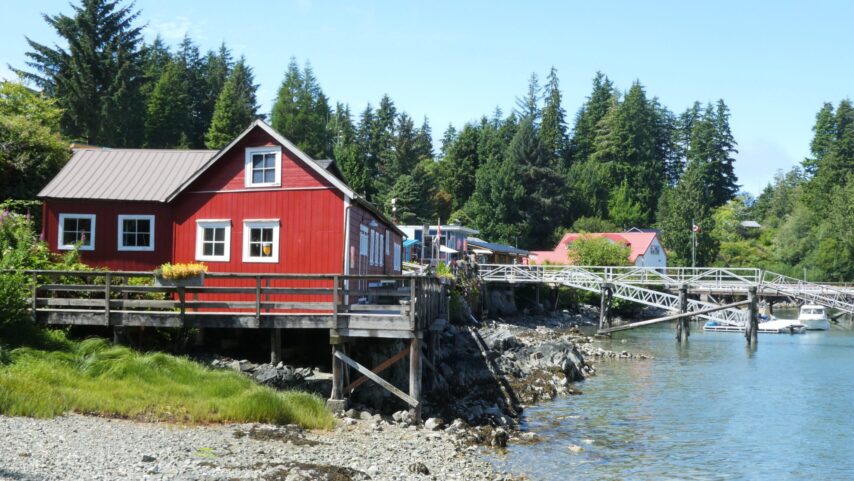 Photo of charming Bamfield with buildings on pilings along the waterfront
