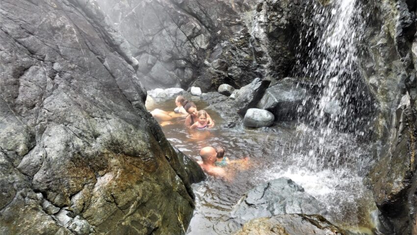 Photo of family enjoying the hot springs at Hot Springs Cove near Tofino BC