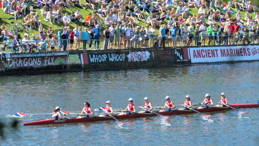 Female crew competing along the Montlake Cut in Seattle during Opening Day