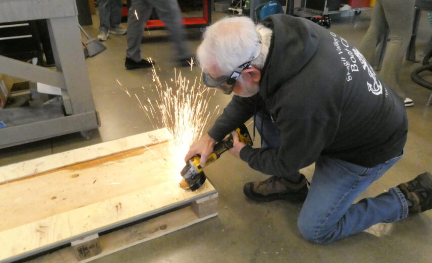 Volunteer Charley constructing an engine cart